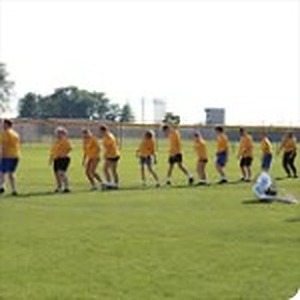 Lincolnview woodwind section practicing marching drill in yellow shirts